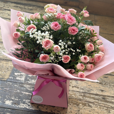 Spray Rose Hand Tied - Spray roses arranged with gypsophila and foliage.

Standard - 10 stems 
Medium - 15 stems 
large - 20 stems